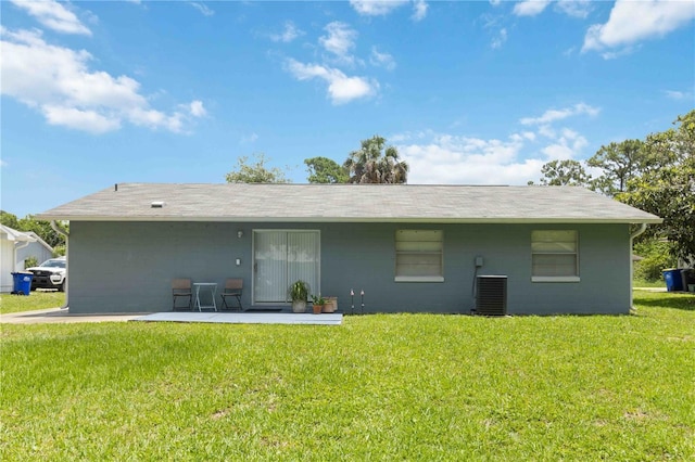 1920 Travelers Palm Dr, Edgewater, FL 32141 - back of property with a yard, concrete block siding, and a patio