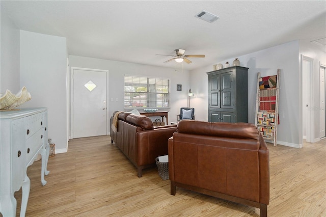 1920 Travelers Palm Dr, Edgewater, FL 32141 - living area with a ceiling fan and light wood-style floors