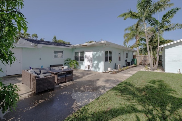 653 Goodwin Ave, New Smyrna Beach, FL 32169 - back of property featuring outdoor lounge area, a patio, and stucco siding