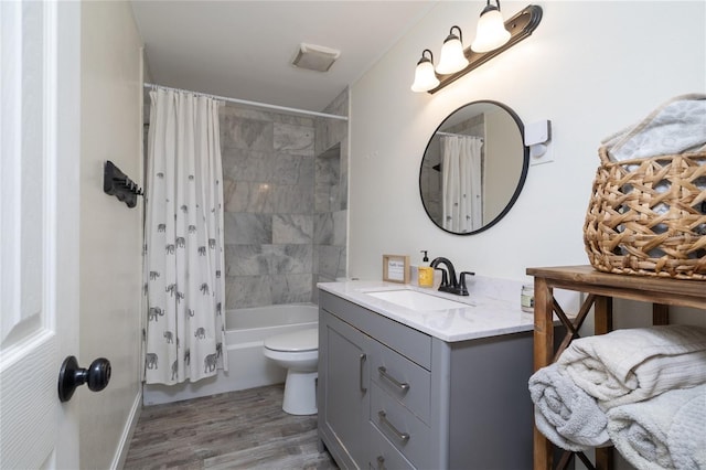 653 Goodwin Ave, New Smyrna Beach, FL 32169 - full bath with vanity, wood finished floors, and shower / bath combination with curtain