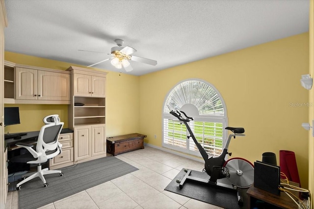 5935 Shady Creek Ln, Port Orange, FL 32128 - home office with ceiling fan, light tile patterned floors, and a textured ceiling