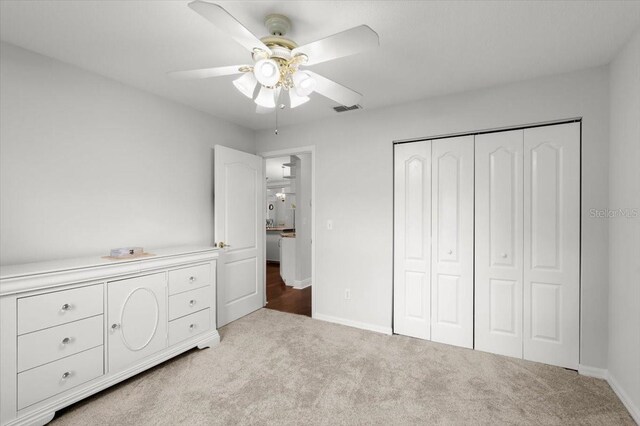 5935 Shady Creek Ln, Port Orange, FL 32128 - bedroom with carpet, a closet, and ceiling fan