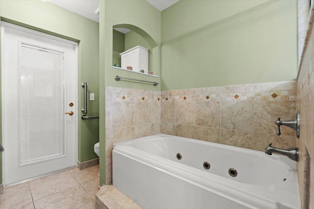 5935 Shady Creek Ln, Port Orange, FL 32128 - bathroom with a jetted tub and tile patterned floors