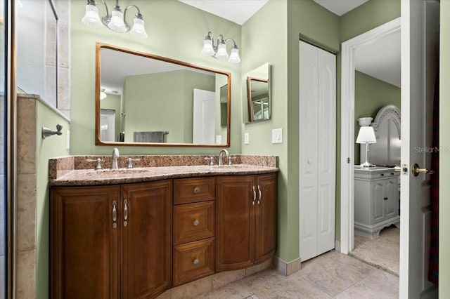 5935 Shady Creek Ln, Port Orange, FL 32128 - bathroom with double vanity and baseboards