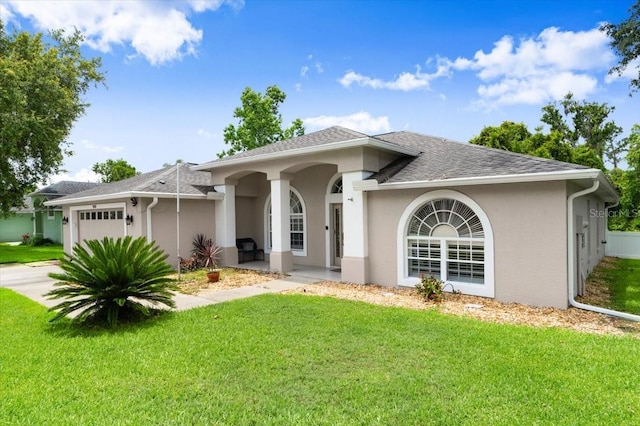 5935 Shady Creek Ln, Port Orange, FL 32128 - ranch-style house featuring an attached garage, stucco siding, a front lawn, and a shingled roof