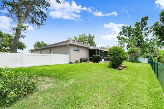 5935 Shady Creek Ln, Port Orange, FL 32128 - fenced backyard with a sunroom