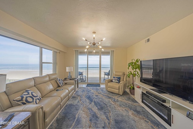 4575 S Atlantic Ave Unit 6203, Ponce Inlet, FL 32127 - living area with a chandelier and carpet flooring