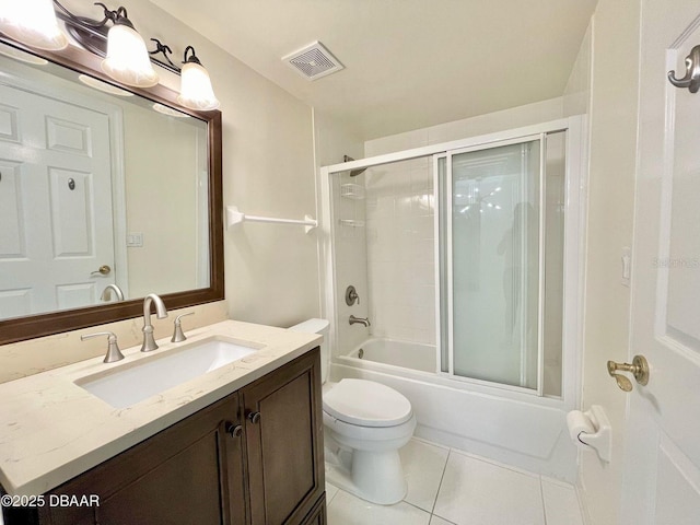 4575 S Atlantic Ave Unit 6203, Ponce Inlet, FL 32127 - bathroom featuring vanity, tile patterned floors, toilet, and bath / shower combo with glass door