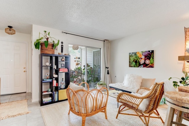 1600 Big Tree Rd Unit R4, South Daytona, FL 32119 - living area featuring light tile patterned floors and a textured ceiling