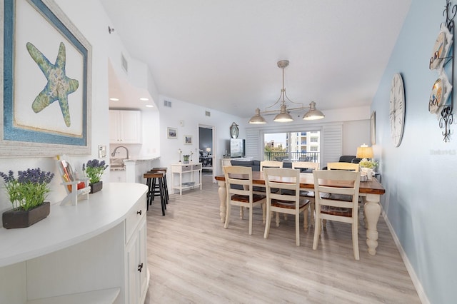 5300 S Atlantic Ave Unit 11302, New Smyrna Beach, FL 32169 - dining room with light wood finished floors and baseboards
