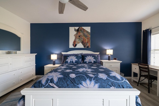5300 S Atlantic Ave Unit 11302, New Smyrna Beach, FL 32169 - bedroom with dark wood-style flooring, ceiling fan, and baseboards