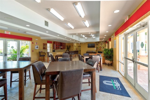 5300 S Atlantic Ave Unit 11302, New Smyrna Beach, FL 32169 - dining area with french doors, recessed lighting, and light tile patterned floors