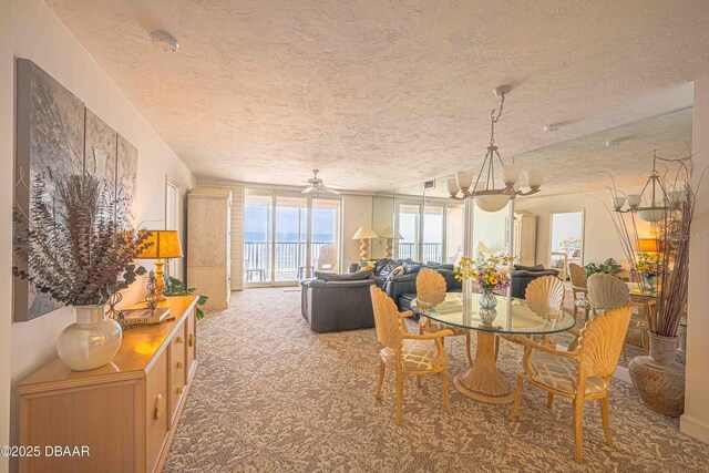 4555 S Atlantic Ave Unit 4405, Ponce Inlet, FL 32127 - dining room with a textured ceiling and carpet flooring