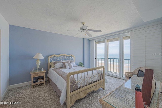 4555 S Atlantic Ave Unit 4405, Ponce Inlet, FL 32127 - bedroom featuring carpet floors, access to outside, a textured ceiling, a water view, and a ceiling fan