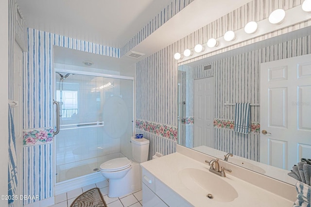 4555 S Atlantic Ave Unit 4405, Ponce Inlet, FL 32127 - bathroom featuring wallpapered walls, tile patterned flooring, vanity, toilet, and a stall shower
