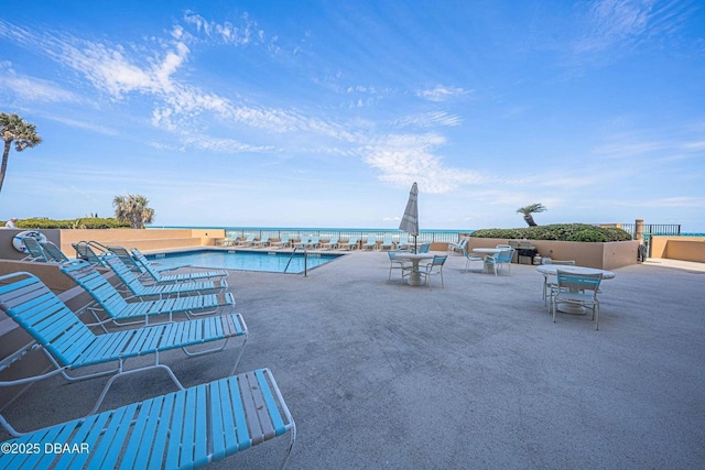 3023 S Atlantic Ave Unit 8010, Daytona Beach, FL 32118 - community pool featuring a patio and outdoor dining area