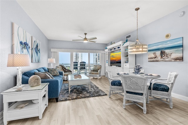 2 Oceans W Blvd Unit 608, Daytona Beach Shores, FL 32118 - living room featuring light wood-style floors, ceiling fan, and baseboards