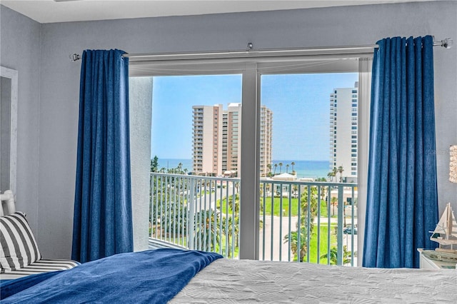 2 Oceans W Blvd Unit 608, Daytona Beach Shores, FL 32118 - bedroom featuring a water view and a textured wall