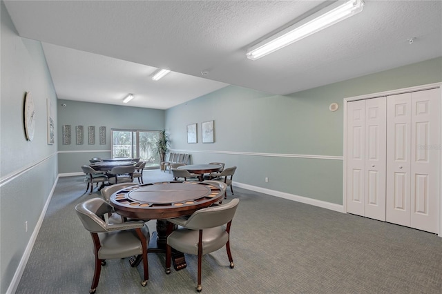 2 Oceans W Blvd Unit 608, Daytona Beach Shores, FL 32118 - dining space featuring carpet floors, baseboards, and a textured ceiling
