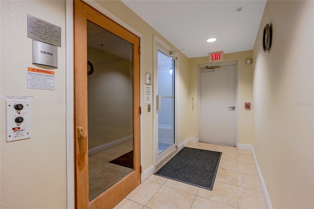 2 Oceans W Blvd Unit 608, Daytona Beach Shores, FL 32118 - hall with light tile patterned floors and baseboards