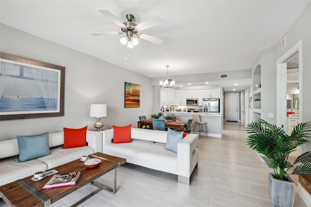 7 Riverwalk Dr Unit 305, New Smyrna Beach, FL 32169 - living area featuring a ceiling fan, a chandelier, light tile patterned floors, and recessed lighting
