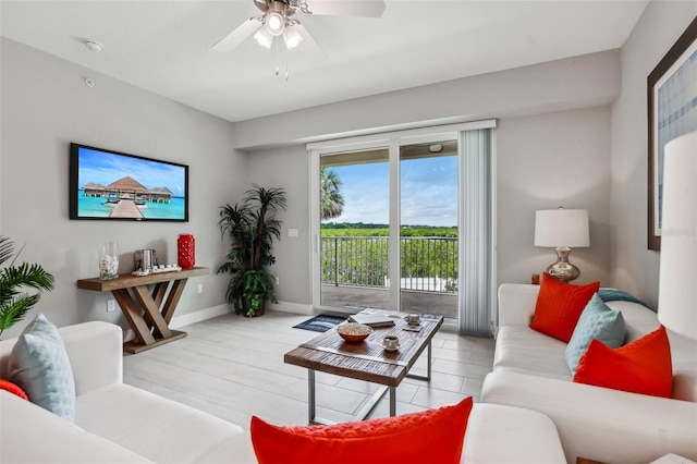 7 Riverwalk Dr Unit 305, New Smyrna Beach, FL 32169 - living room with a ceiling fan and baseboards