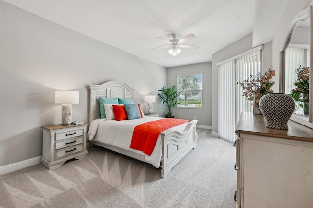 7 Riverwalk Dr Unit 305, New Smyrna Beach, FL 32169 - bedroom featuring light carpet, baseboards, a ceiling fan, and access to exterior