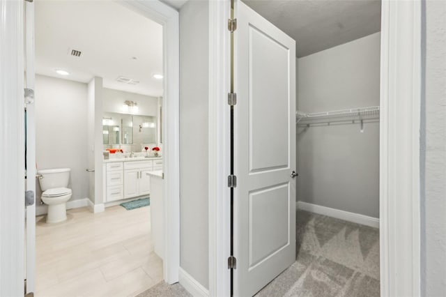 7 Riverwalk Dr Unit 305, New Smyrna Beach, FL 32169 - walk in closet with a sink