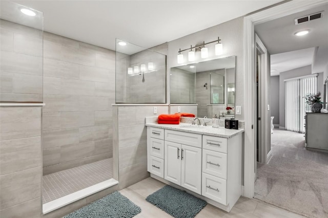 7 Riverwalk Dr Unit 305, New Smyrna Beach, FL 32169 - bathroom featuring walk in shower, vanity, tile patterned floors, and recessed lighting