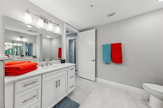 7 Riverwalk Dr Unit 305, New Smyrna Beach, FL 32169 - full bath with toilet, vanity, and baseboards