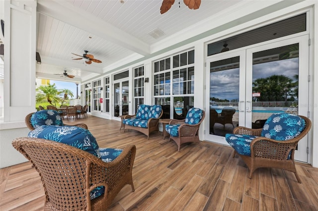 7 Riverwalk Dr Unit 305, New Smyrna Beach, FL 32169 - sunroom / solarium with ceiling fan, french doors, and wooden ceiling with exposed beams