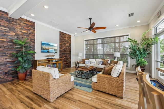 7 Riverwalk Dr Unit 305, New Smyrna Beach, FL 32169 - living area with wood finished floors, a ceiling fan, ornamental molding, recessed lighting, and baseboards