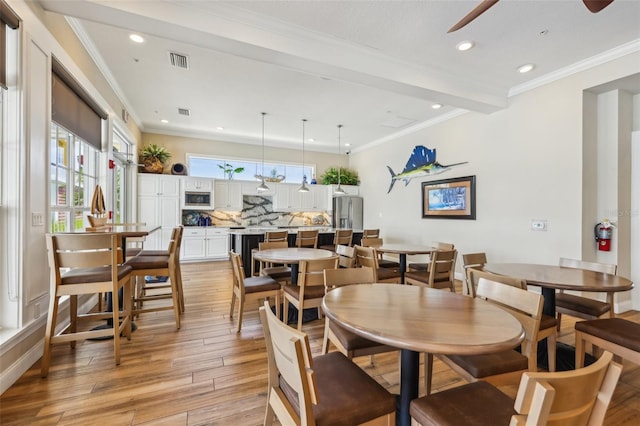 7 Riverwalk Dr Unit 305, New Smyrna Beach, FL 32169 - dining room with light wood finished floors, ceiling fan, recessed lighting, ornamental molding, and beamed ceiling