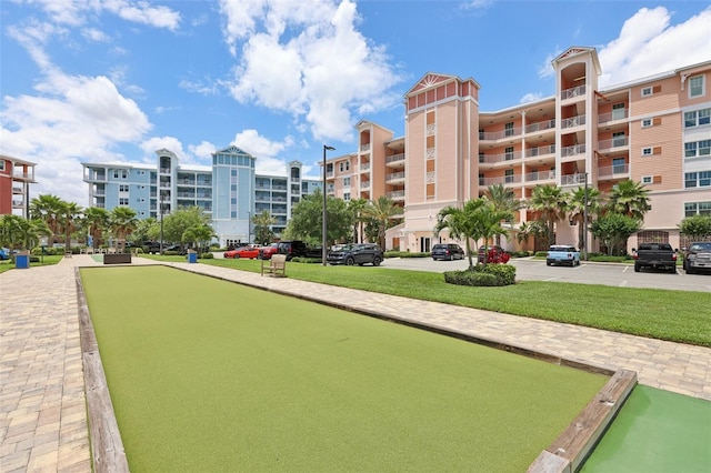 7 Riverwalk Dr Unit 305, New Smyrna Beach, FL 32169 - view of community featuring a lawn and a bocce ball area