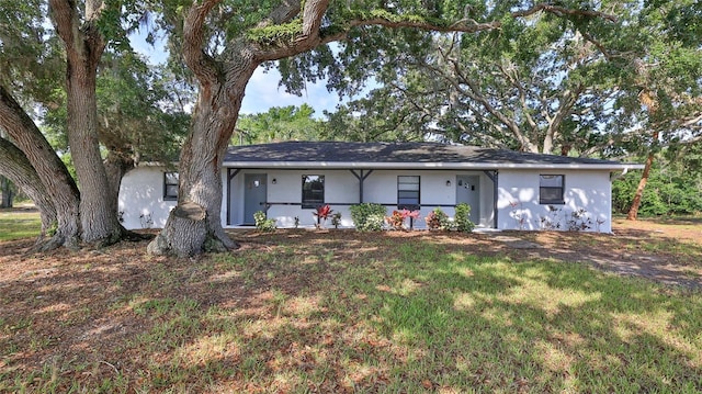 1802 N Fern Palm Dr, Edgewater, FL 32132 - ranch-style home with stucco siding and a front yard