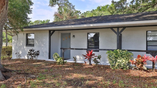 1802 N Fern Palm Dr, Edgewater, FL 32132 - view of front of home with roof with shingles and stucco siding