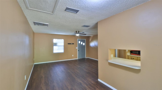 1802 N Fern Palm Dr, Edgewater, FL 32132 - entryway featuring a textured ceiling, dark wood-style floors, baseboards, and a ceiling fan
