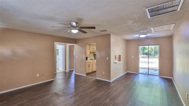 1802 N Fern Palm Dr, Edgewater, FL 32132 - spare room featuring a sink, dark wood-style floors, baseboards, a textured ceiling, and a ceiling fan
