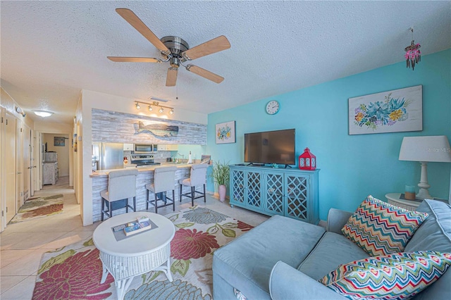 3615 S Atlantic Ave Unit 211, Daytona Beach, FL 32118 - living area with a textured ceiling, ceiling fan, and light tile patterned flooring
