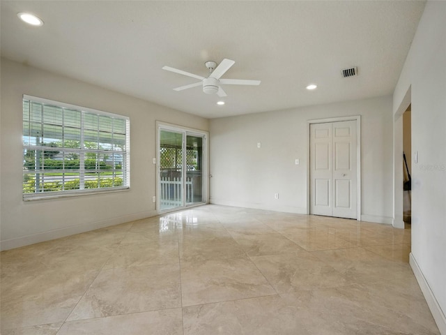 2 Birdie Dr, New Smyrna Beach, FL 32168 - empty room with a ceiling fan and recessed lighting