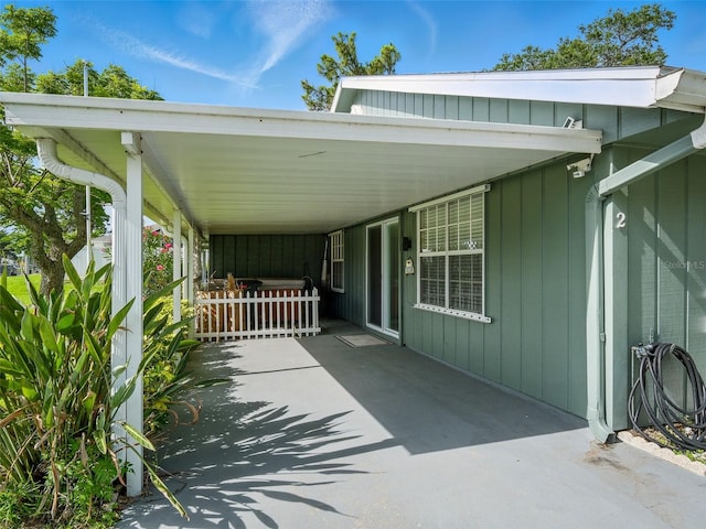 2 Birdie Dr, New Smyrna Beach, FL 32168 - view of vehicle parking featuring an attached carport