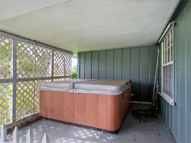 2 Birdie Dr, New Smyrna Beach, FL 32168 - unfurnished sunroom with a hot tub