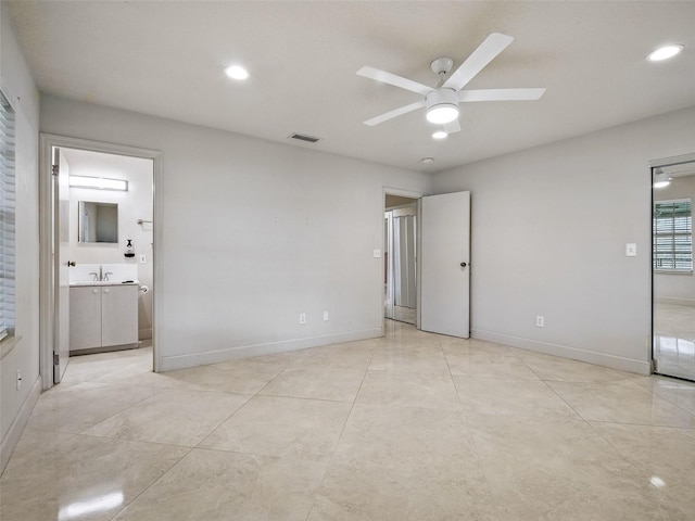 2 Birdie Dr, New Smyrna Beach, FL 32168 - unfurnished bedroom with recessed lighting, ensuite bath, and ceiling fan