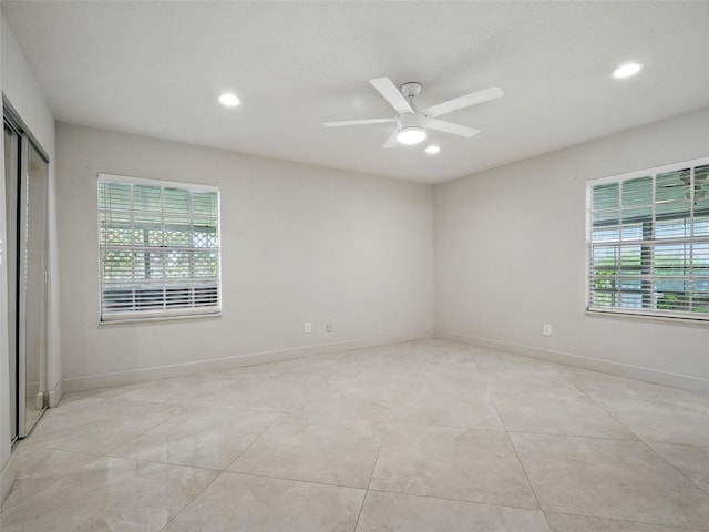 2 Birdie Dr, New Smyrna Beach, FL 32168 - unfurnished room with recessed lighting, light tile patterned floors, and ceiling fan