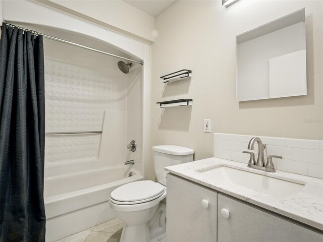 2 Birdie Dr, New Smyrna Beach, FL 32168 - full bathroom featuring shower / bath combo, vanity, backsplash, and tile patterned floors