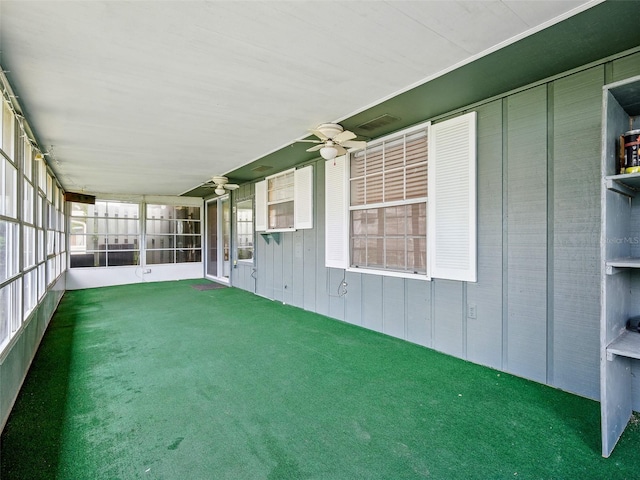 2 Birdie Dr, New Smyrna Beach, FL 32168 - unfurnished sunroom featuring a ceiling fan
