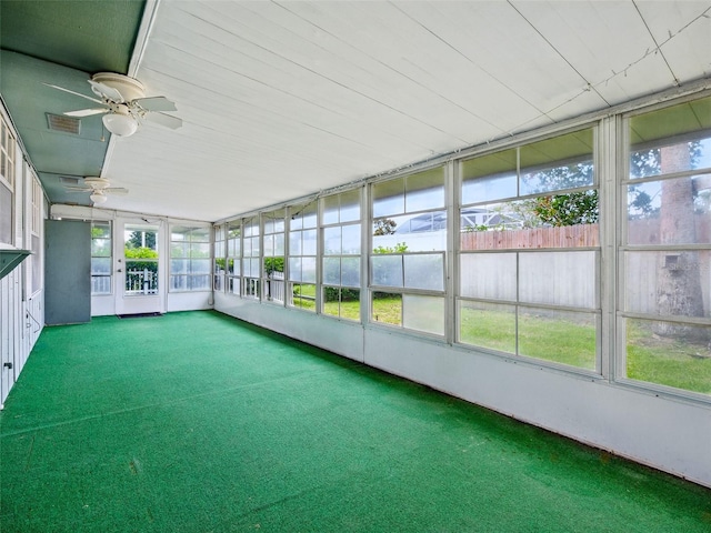 2 Birdie Dr, New Smyrna Beach, FL 32168 - unfurnished sunroom featuring a ceiling fan