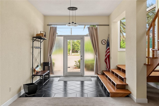 6956 Turtlemound Rd, New Smyrna Beach, FL 32169 - foyer entrance with stairway and a textured wall