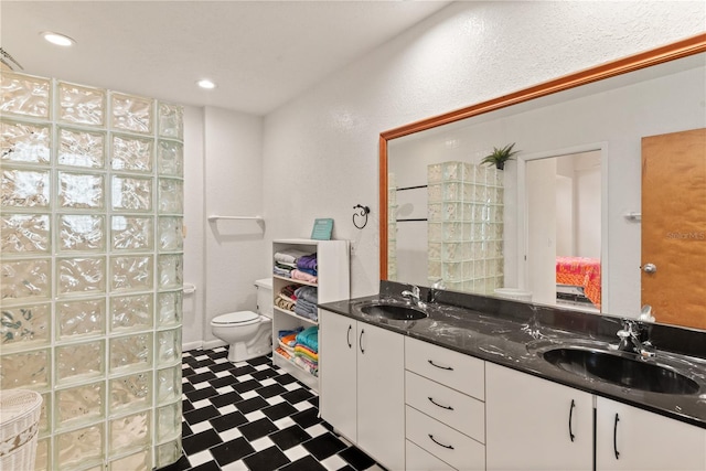 6956 Turtlemound Rd, New Smyrna Beach, FL 32169 - bathroom with tile patterned floors, double vanity, and recessed lighting
