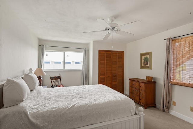 6956 Turtlemound Rd, New Smyrna Beach, FL 32169 - bedroom featuring a closet, light carpet, and a ceiling fan